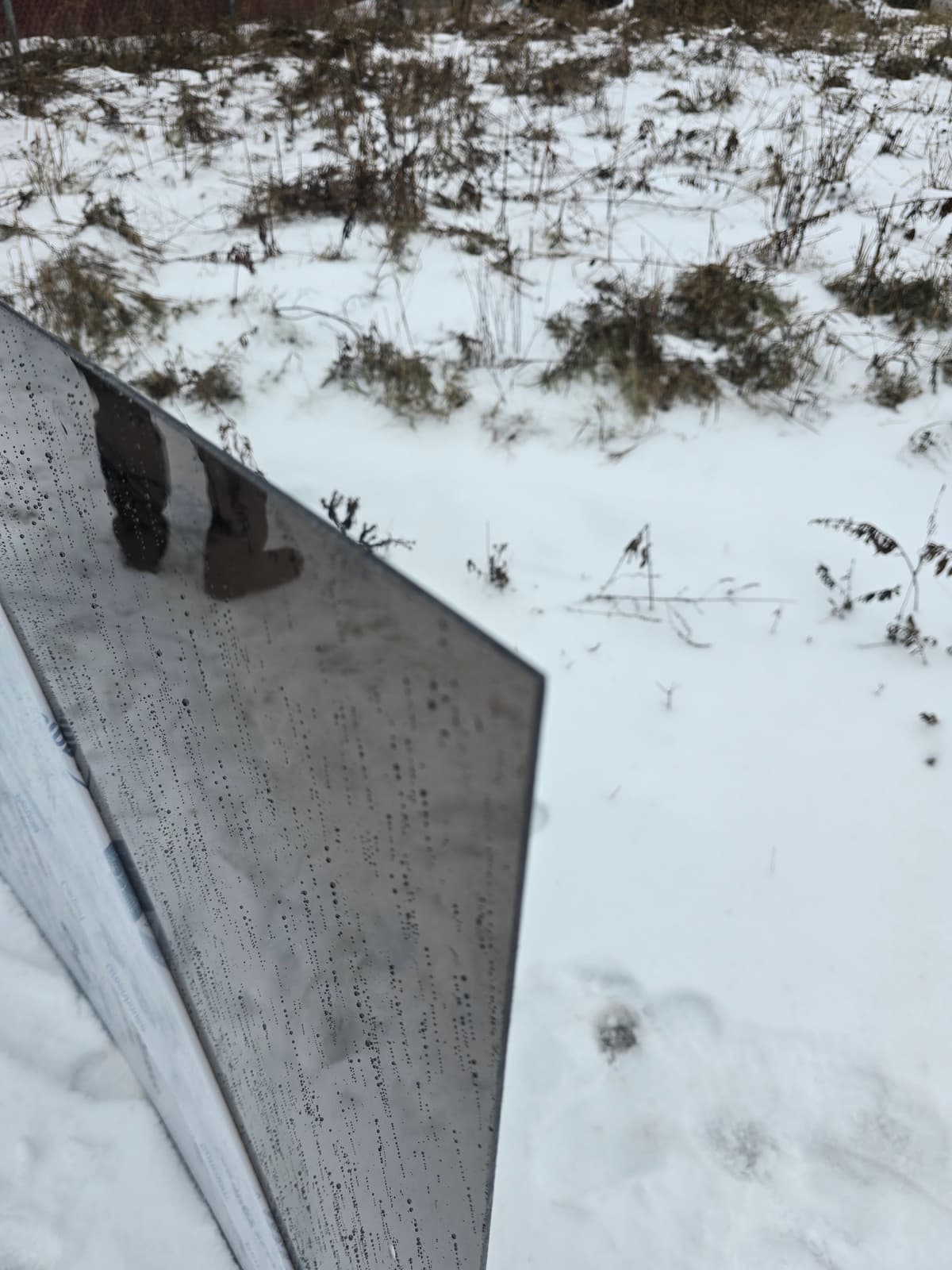 Polycarbonate sheet installed as window glazing in winter conditions