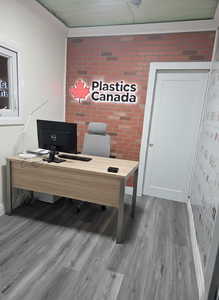 Plastics Canada office with brick wall logo and modern workspace